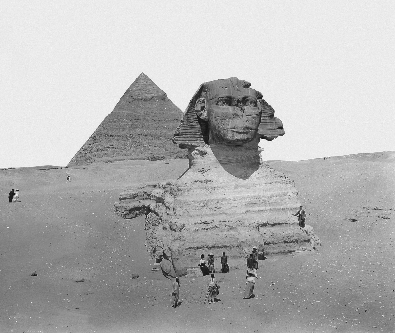 A black and white photograph of the Great Sphinx of Giza, a massive limestone statue with the head of a human and the body of a lion.