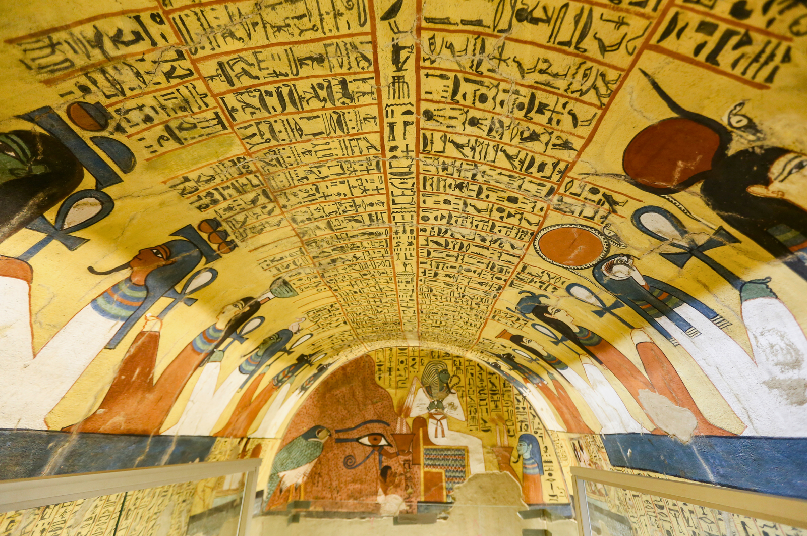 A close-up of the ceiling in the Tomb of Pashedu in Deir el-Medina, showcasing the vibrant colors, hieroglyphs, and religious imagery.