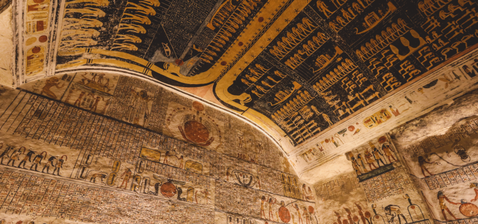 A vibrant and colorful ceiling in the Tomb of Ramses VI (KV9) in the Valley of the Kings, Luxor, Egypt, featuring astronomical scenes and hieroglyphs.