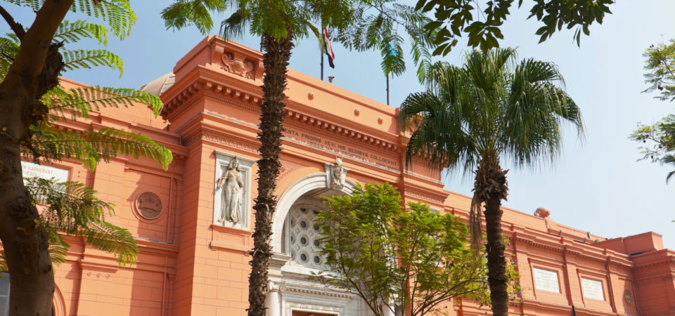 Exterior view of the Egyptian Museum in Cairo, showcasing its grand façade and entrance.