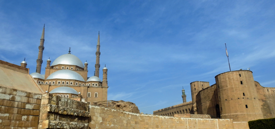 A panoramic view of the Citadel of Saladin in Cairo, showcasing the Mosque of Muhammad Ali and the surrounding fortress walls.