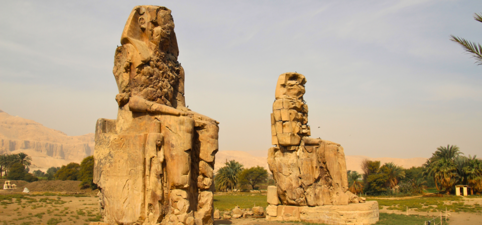 The Colossi of Memnon, two massive stone statues of Pharaoh Amenhotep III.