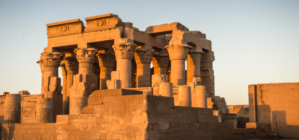 The entrance to Kom Ombo Temple, showcasing twin sanctuaries and ornate columns.