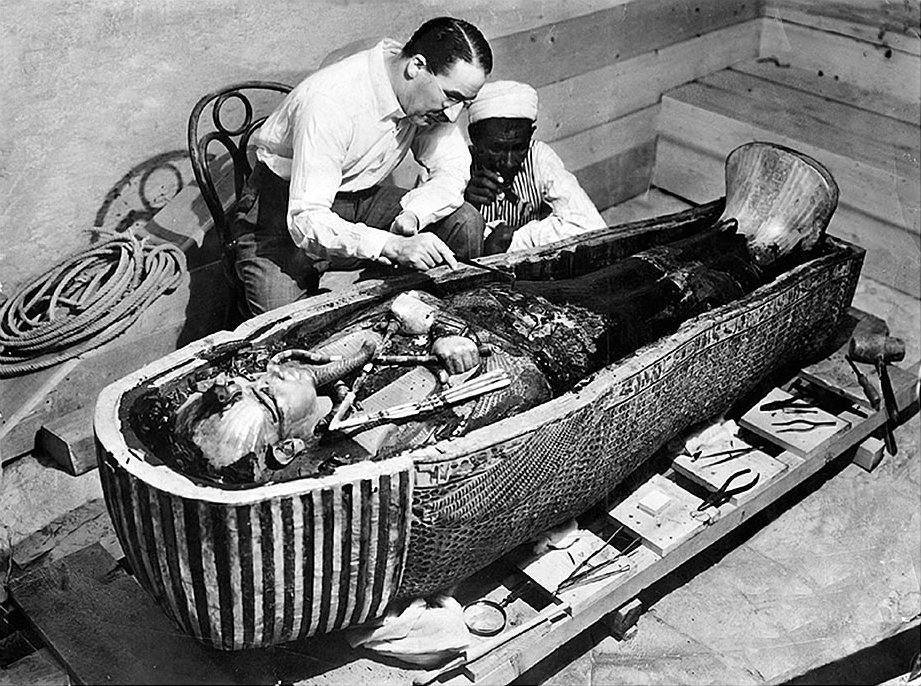 Carter and one of the foremen work on the innermost coffin