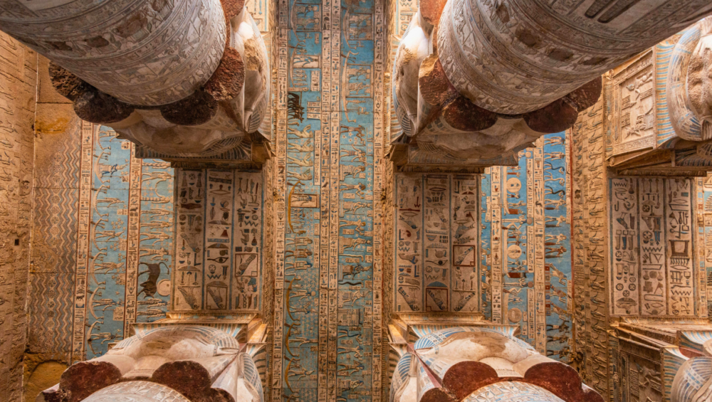 A close-up of the astrological ceiling in the Dendera Temple, showcasing intricate carvings of zodiac signs, planets, and constellations.