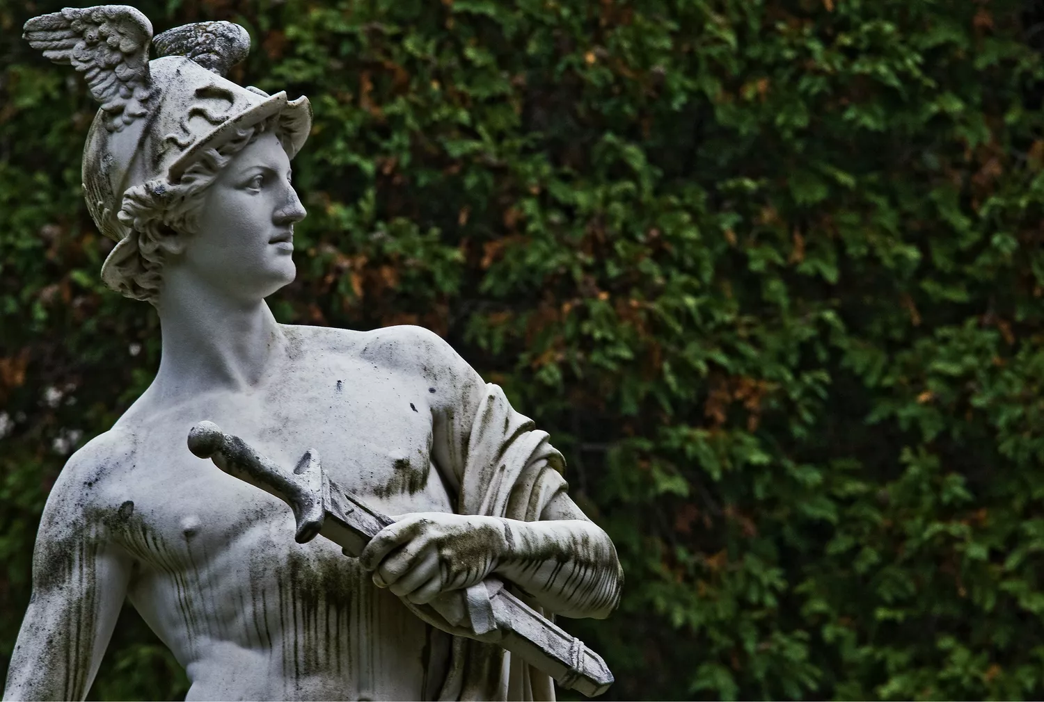 A painting or sculpture depicting Hermes, the Greek god, holding a caduceus and wearing winged sandals.