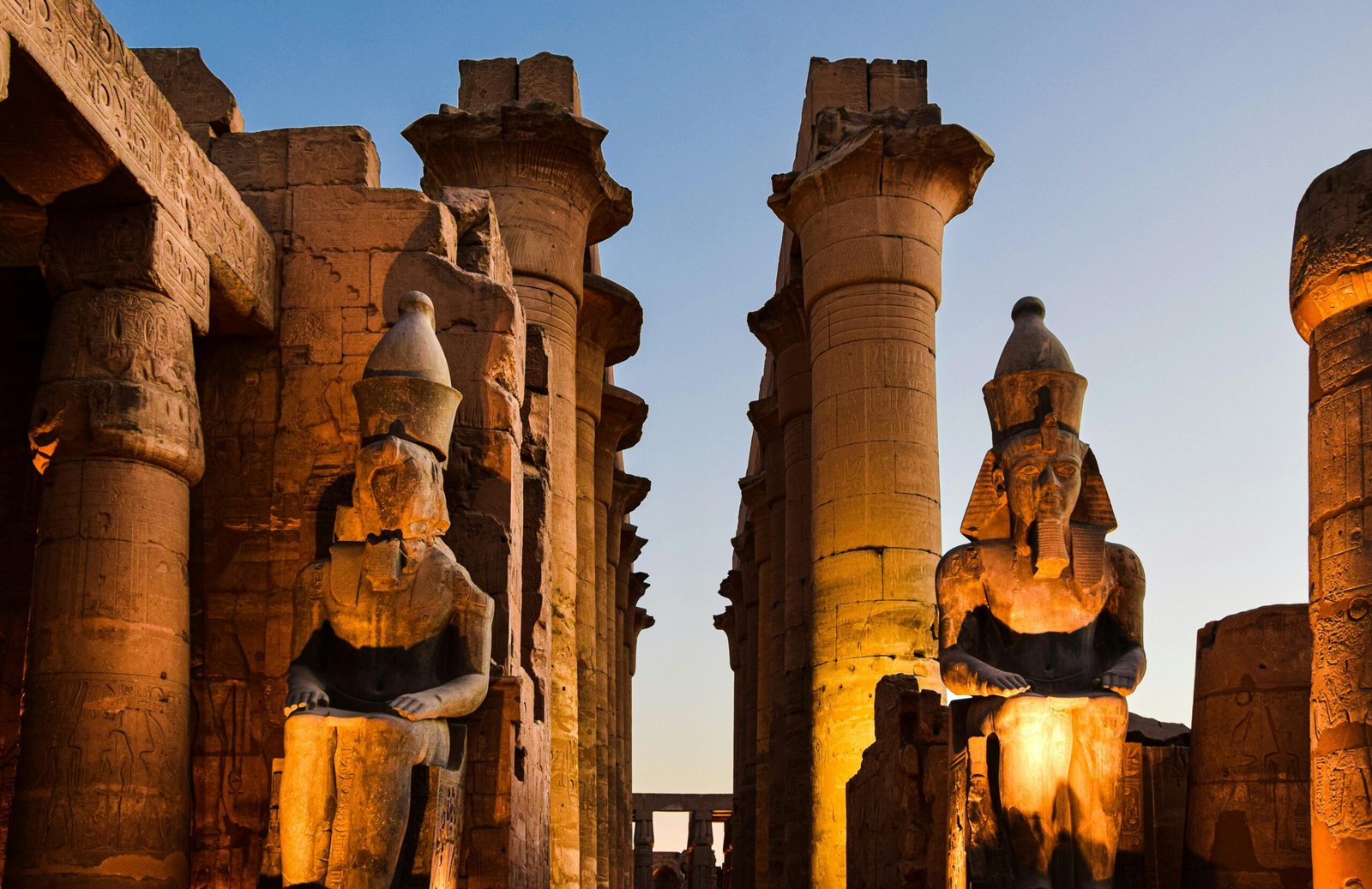 Luxor Temple, bathed in the soft glow of moonlight, stands as a testament to the grandeur of ancient Egypt.