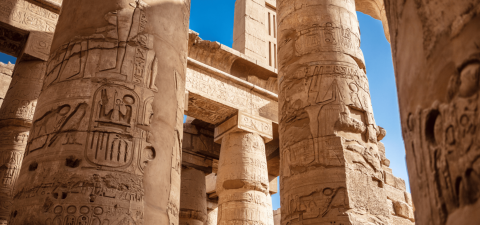 Intricately carved columns in the Hypostyle Hall at Karnak Temple.