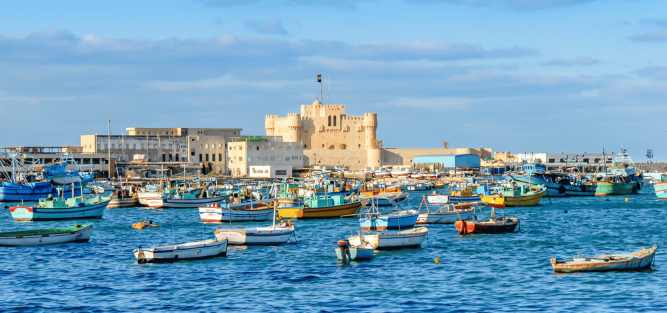 The Citadel of Qaitbay, surrounded by fishing boats, overlooking the Mediterranean Sea in Alexandria.