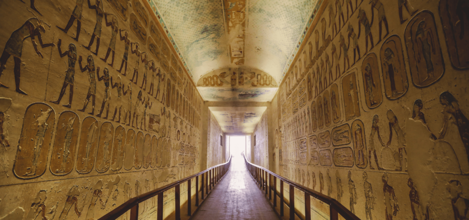 Corridor inside a tomb at the Valley of the Kings with hieroglyphic-covered walls.