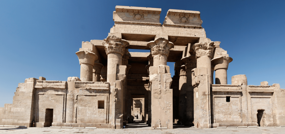 Kom Ombo Temple in Aswan with detailed ancient carvings and blue sky backdrop.