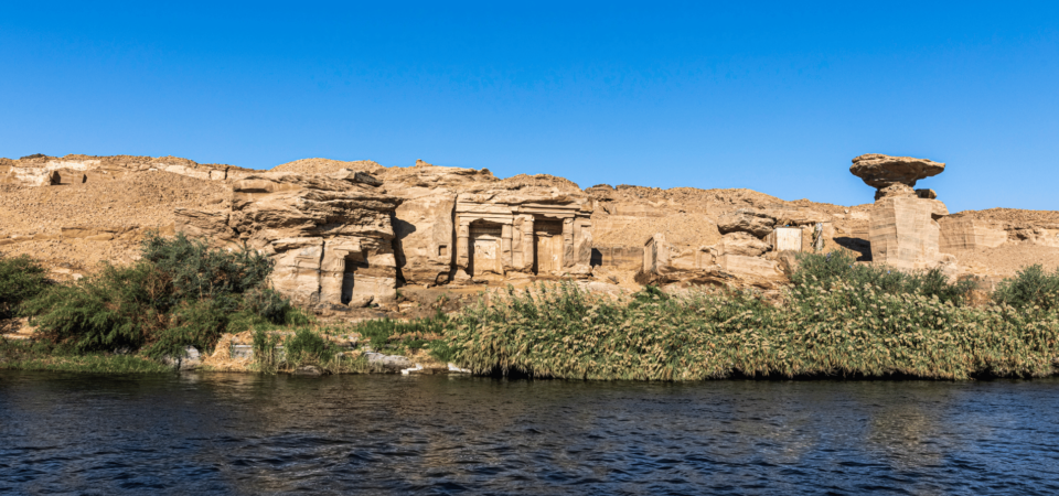 Ruins of Gebel el-Silsila along the Nile River with ancient sandstone quarries.