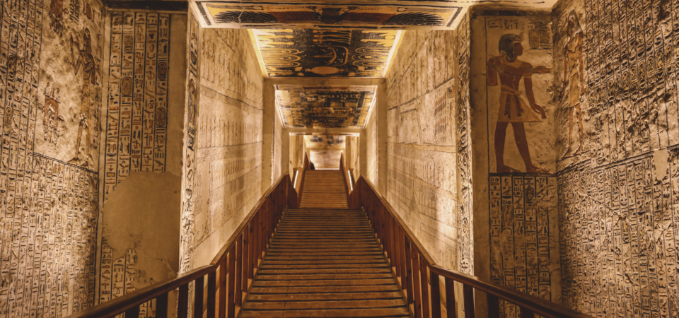 Interior corridor of the Valley of the Kings with ornate wall carvings.