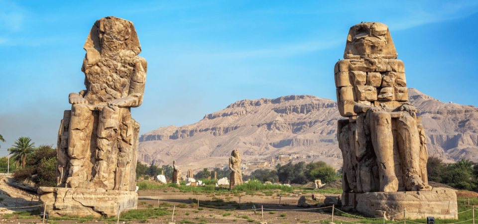 The towering Colossi of Memnon statues in Luxor, Egypt.