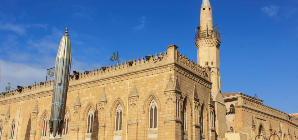 A close-up of intricate Islamic architectural details at the Al-Hussein Mosque