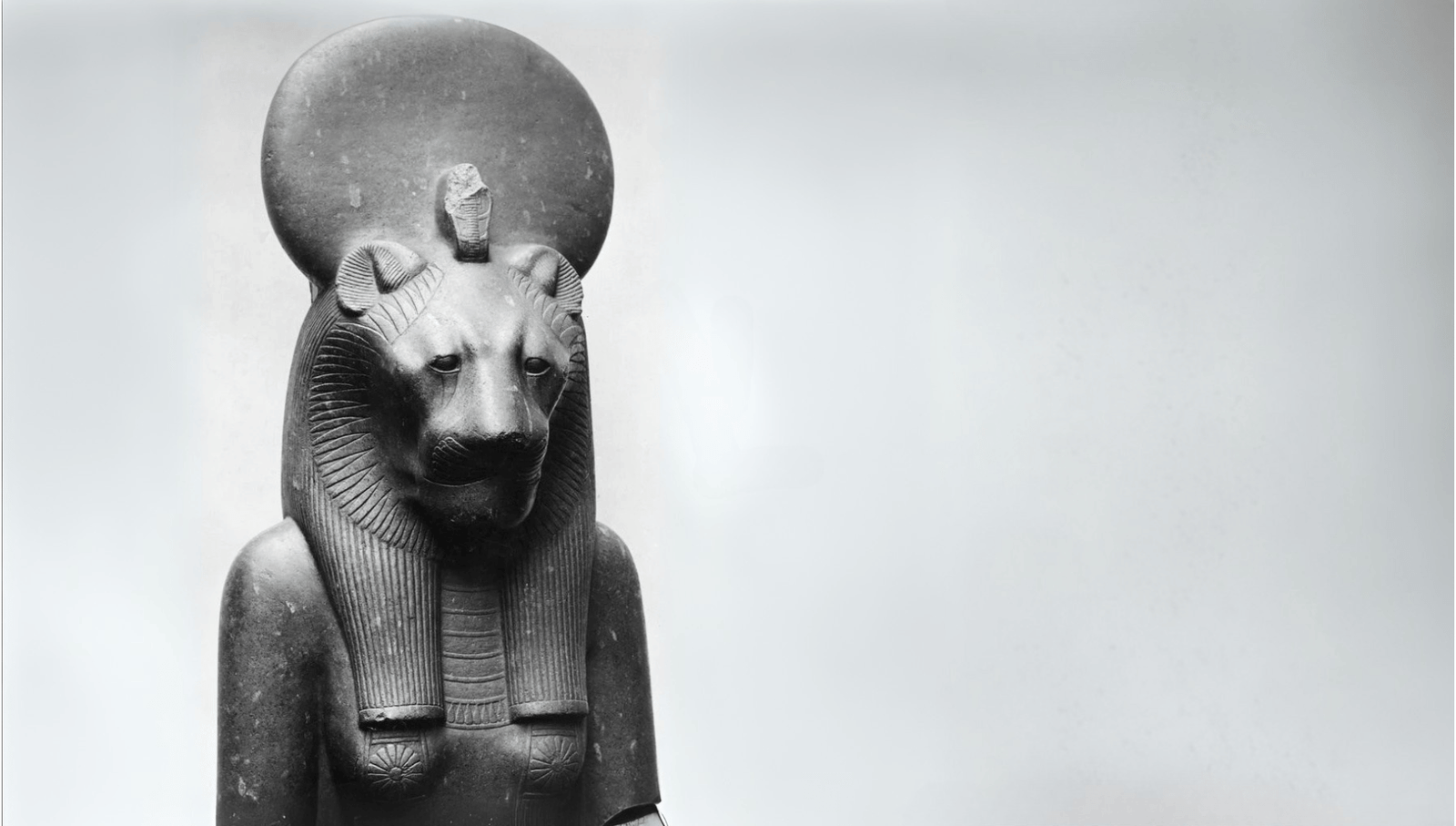 Black granite statue of Sekhmet with a solar crown.